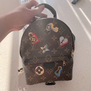 LV Monogram Love Lock Palm Springs Backpack Mini